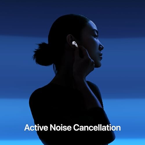 Silhouette of a person using earbuds with active noise cancellation