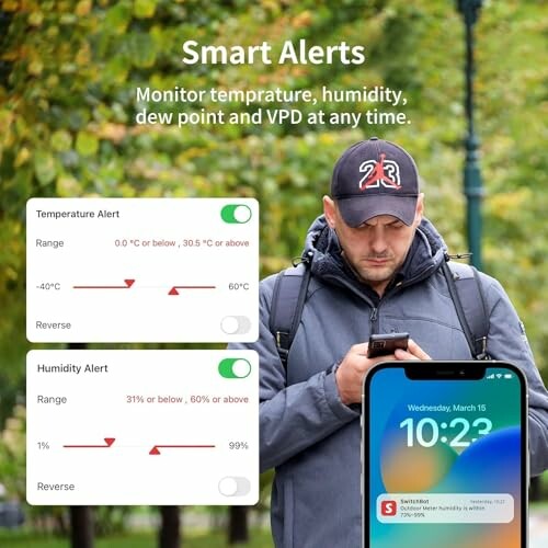 Man checking phone with smart alerts for temperature and humidity.